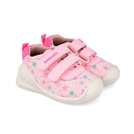 Βρεφικά sneakers Biomecanics για κορίτσι σε λευκό δέρμα με ροζ λεπτομέρειες και κλείσιμο velcro.
