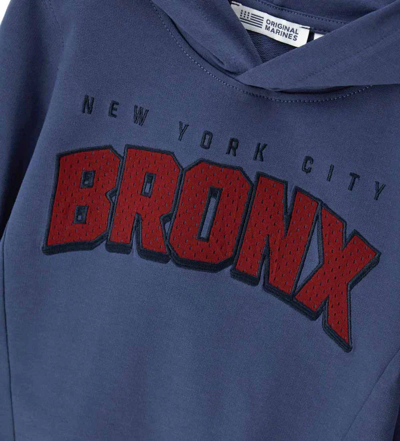 Φούτερ Original Marines με μακριά μανίκια από βαμβάκι, επενδεδυμένη κουκούλα, στάμπα και κεντημένη εφαρμογή από δίχτυ στο μπροστινό μέρος.