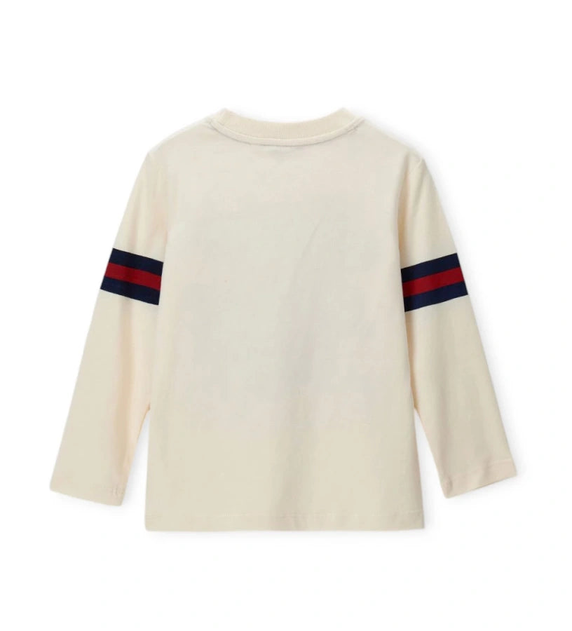 Μπλουζάκι μακρυμάνικο σε εκρού χρώμα, από απαλό βαμβάκι, με στρογγυλή λαιμόκοψη και ριμπ τελείωμα. Διακοσμημένο με στάμπες, ιδανικό για άνετες και μοντέρνες εμφανίσεις.