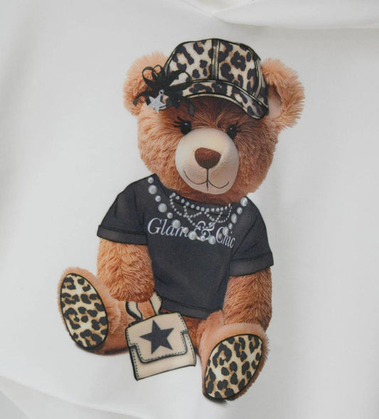 Κοντό φούτερ με κουκούλα από ελαστικό βαμβάκι και μακριά μανίκια. Τύπωμα με glitter και μισές πέρλες στο μπροστινό μέρος για ένα μοντέρνο και λαμπερό στυλ.