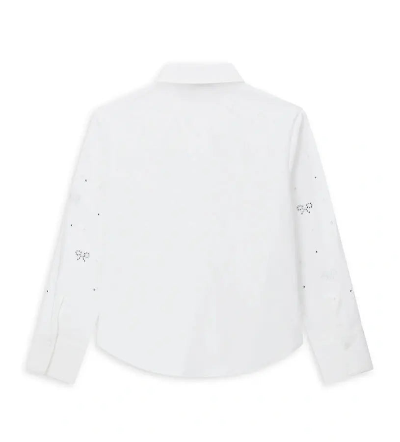 Παιδικό πουκάμισο από βαμβάκι με κουμπιά στο μπροστινό μέρος, μακριά μανίκια και μανσέτες με κουμπί. Διαθέτει αφαιρούμενο φιόγκο από λαμιναρισμένο ύφασμα και στρας στο μπροστινό μέρος και στα μανίκια για ένα λαμπερό και μοντέρνο στυλ.