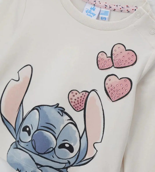 Μπλούζα Disney Stitch από ελαστικό βαμβάκι με στρογγυλή λαιμόκοψη, μακριά μανίκια και τύπωμα διακοσμημένο με στρας στο μπροστινό μέρος. Άνετη και λαμπερή.