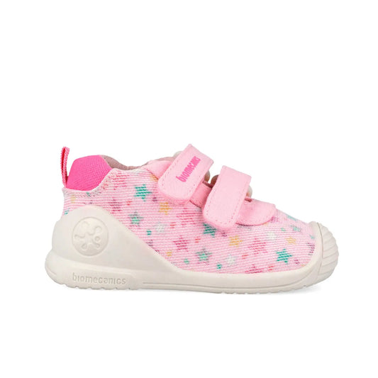 Βρεφικά sneakers Biomecanics για κορίτσι σε λευκό δέρμα με ροζ λεπτομέρειες και κλείσιμο velcro.