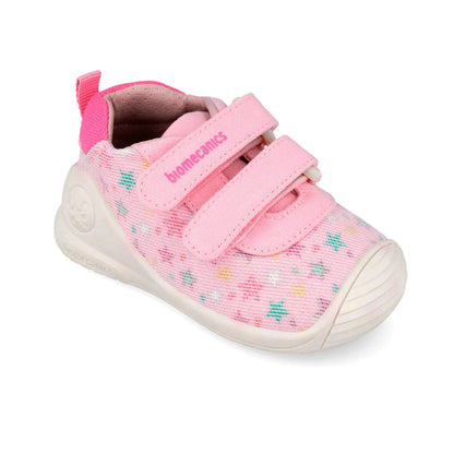 Βρεφικά sneakers Biomecanics για κορίτσι σε λευκό δέρμα με ροζ λεπτομέρειες και κλείσιμο velcro.