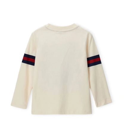 Μπλουζάκι μακρυμάνικο σε εκρού χρώμα, από απαλό βαμβάκι, με στρογγυλή λαιμόκοψη και ριμπ τελείωμα. Διακοσμημένο με στάμπες, ιδανικό για άνετες και μοντέρνες εμφανίσεις.