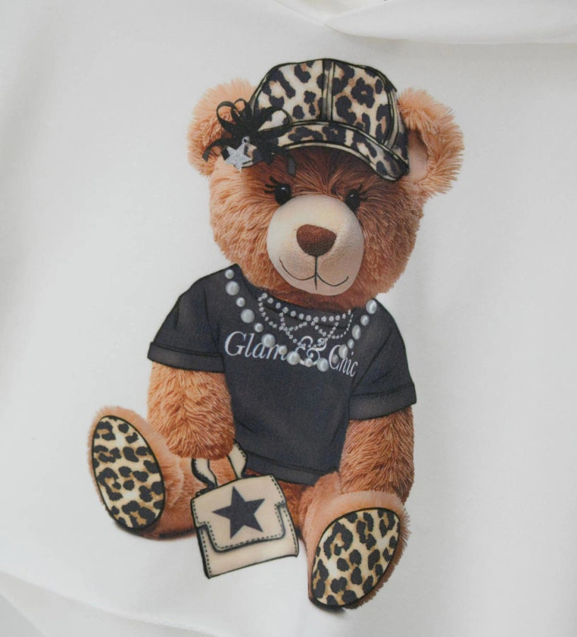 Κοντό φούτερ με κουκούλα από ελαστικό βαμβάκι και μακριά μανίκια. Τύπωμα με glitter και μισές πέρλες στο μπροστινό μέρος για ένα μοντέρνο και λαμπερό στυλ.