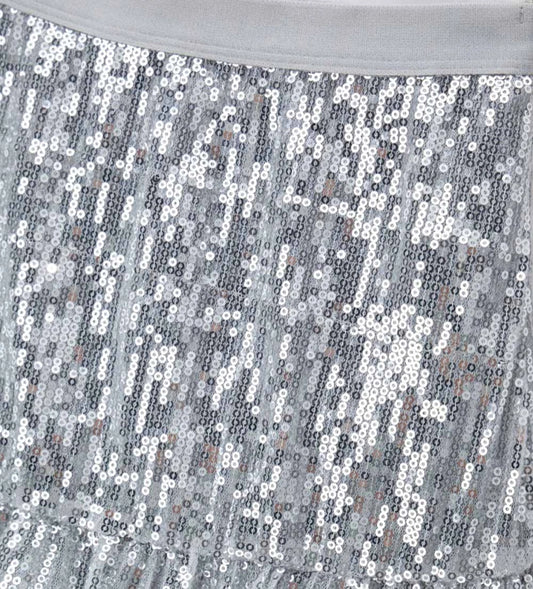 Φούστα από ύφασμα με παγιέτες, ελαστική μέση και πλαϊνό άνοιγμα, με εσωτερική φόδρα από ελαστικό βαμβάκι για μια λαμπερή και εντυπωσιακή εμφάνιση.