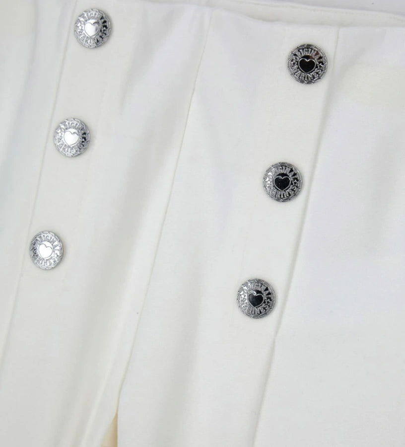 Παντελόνι από ύφασμα Milano με ελαστική μέση για άνετη εφαρμογή. Διακοσμημένα κουμπιά με λεπτομέρειες στο μπροστινό μέρος, ιδανικό για κάθε περίσταση.