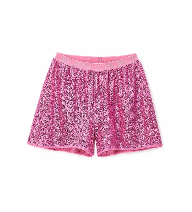 Βερμούδα από ύφασμα με πούλιες, με ελαστική μέση στο ίδιο χρώμα και βαμβακερή φόδρα για άνεση. Ένα λαμπερό και μοντέρνο κομμάτι, ιδανικό για κομψές και λαμπερές εμφανίσεις.