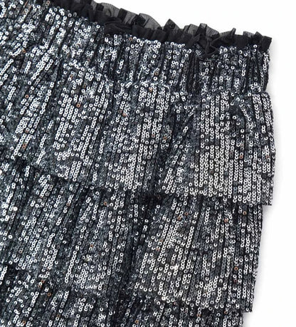 Φούστα από ύφασμα με πούλιες, με ελαστική μέση για άνετη εφαρμογή, τρία βολάν και βαμβακερή φόδρα, για μια λαμπερή εμφάνιση ιδανική για κάθε ιδιαίτερη περίσταση.