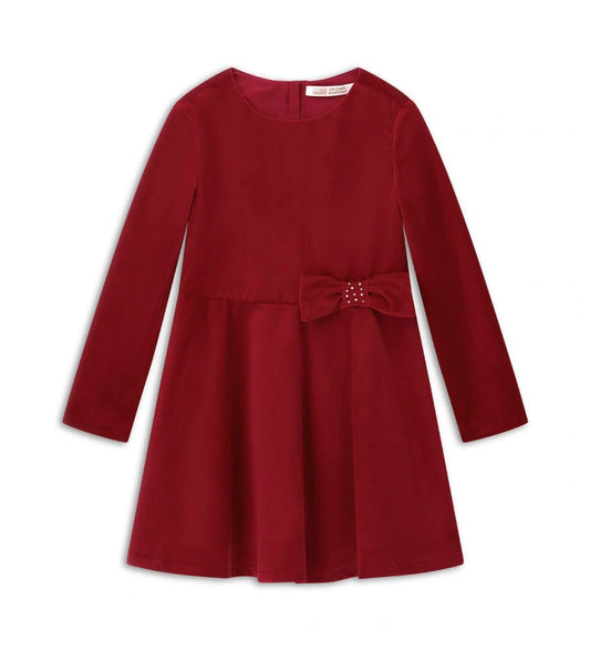 Φόρεμα από βελούδο με στρογγυλή λαιμόκοψη και κλείσιμο στο πίσω μέρος με αόρατο φερμουάρ. Μακριά μανίκια και βαμβακερή φόδρα, διακοσμημένο με φιόγκο στη μέση για ένα κομψό και εκλεπτυσμένο look.