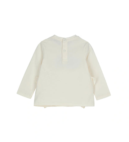 Βαμβακερή μπλούζα με στρογγυλή λαιμόκοψη και μακριά μανίκια. Διαθέτει πρακτικό άνοιγμα με κουμπιά-σούστες στο πίσω μέρος και είναι διακοσμημένη με βολάν, τύπωμα και κέντημα στο μπροστινό μέρος, για μοντέρνα και απαλή εμφάνιση.