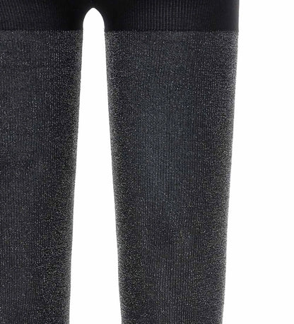 Καλσόν από μικροΐνες με ριγέ σχέδιο και λεπτομέρειες lurex. Άνετο και κομψό, ιδανικό για ιδιαίτερες περιστάσεις.