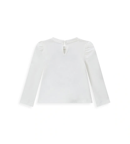 Λευκή μπλούζα Disney Minnie Mouse από ελαστικό βαμβάκι με στρογγυλή λαιμόκοψη, μακριά μανίκια με βολάν, δάκρυ άνοιγμα με κουμπί στο πίσω μέρος και μπροστινό τύπωμα με γκλίτερ λεπτομέρειες.