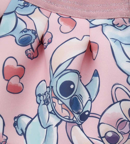 Φούστα από νεοπρένιο με σχέδιο Disney Stitch και άνετη ελαστική μέση από λούρεξ ζακάρ. Τολμηρή και φωτεινή, ιδανική για ζωηρά και διασκεδαστικά looks.
