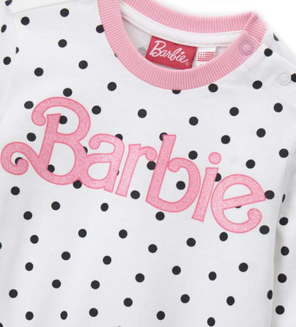 Πυτζάμα βαμβακερή Barbie, με μπλούζα με στρογγυλή λαιμόκοψη, allover τύπωμα με glitter, άνοιγμα στον ώμο και ριμπ τελειώματα, και παντελόνι σετ με φιόγκο και allover τύπωμα.