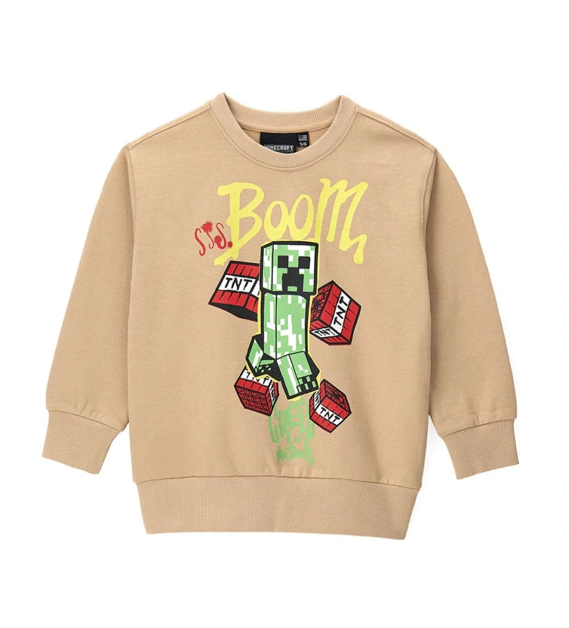 Παιδικό φούτερ Minecraft από βαμβακερό fleece με στρογγυλή λαιμόκοψη, τύπωμα στο μπροστινό μέρος και ριμπ τελειώματα. Απαλό και άνετο, ιδανικό για όλους τους μικρούς fans του δημοφιλούς video game. Προσφέρει ζεστασιά και στυλ στις καθημερινές εμφανίσεις.