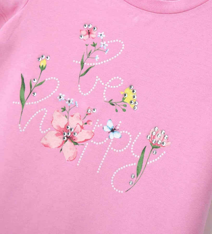 Λεπτομέρεια από τα στρας και το glitter στο μπροστινό μέρος του κοριτσίστικου T-shirt.