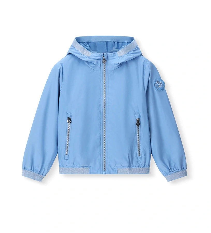 Παιδικό αντιανεμικό μπουφάν για κορίτσι σε γαλάζιο χρώμα με κουκούλα και lurex άκρες.