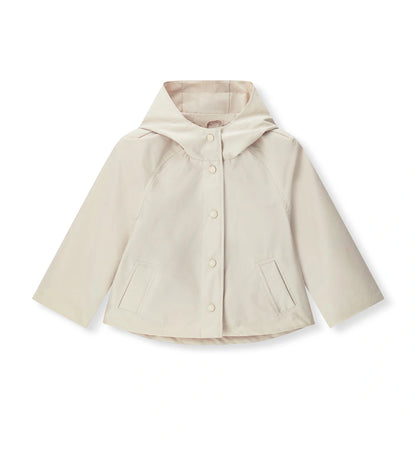 Παιδικό μπουφάν για κορίτσι σε μπεζ χρώμα με κουκούλα και κουμπιά.