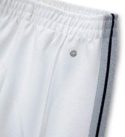 Λεπτομέρεια από το lurex piping στα πλάγια και την ελαστική μέση του κοριτσίστικου παντελονιού.