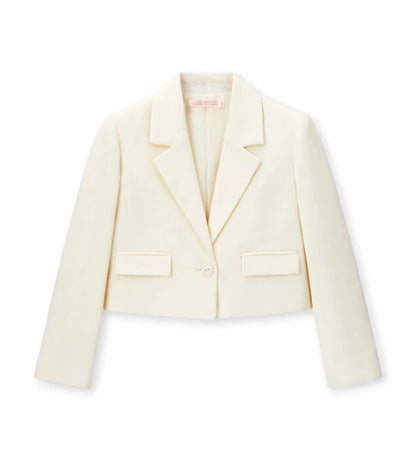 Παιδικό blazer για κορίτσι σε κοντή γραμμή κρεμ χρώματος με γιακά πέτο.