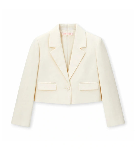 Παιδικό blazer για κορίτσι σε κοντή γραμμή κρεμ χρώματος με γιακά πέτο.