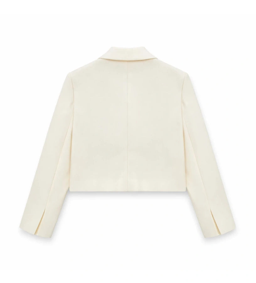 Παιδικό blazer για κορίτσι σε κοντή γραμμή κρεμ χρώματος με γιακά πέτο.